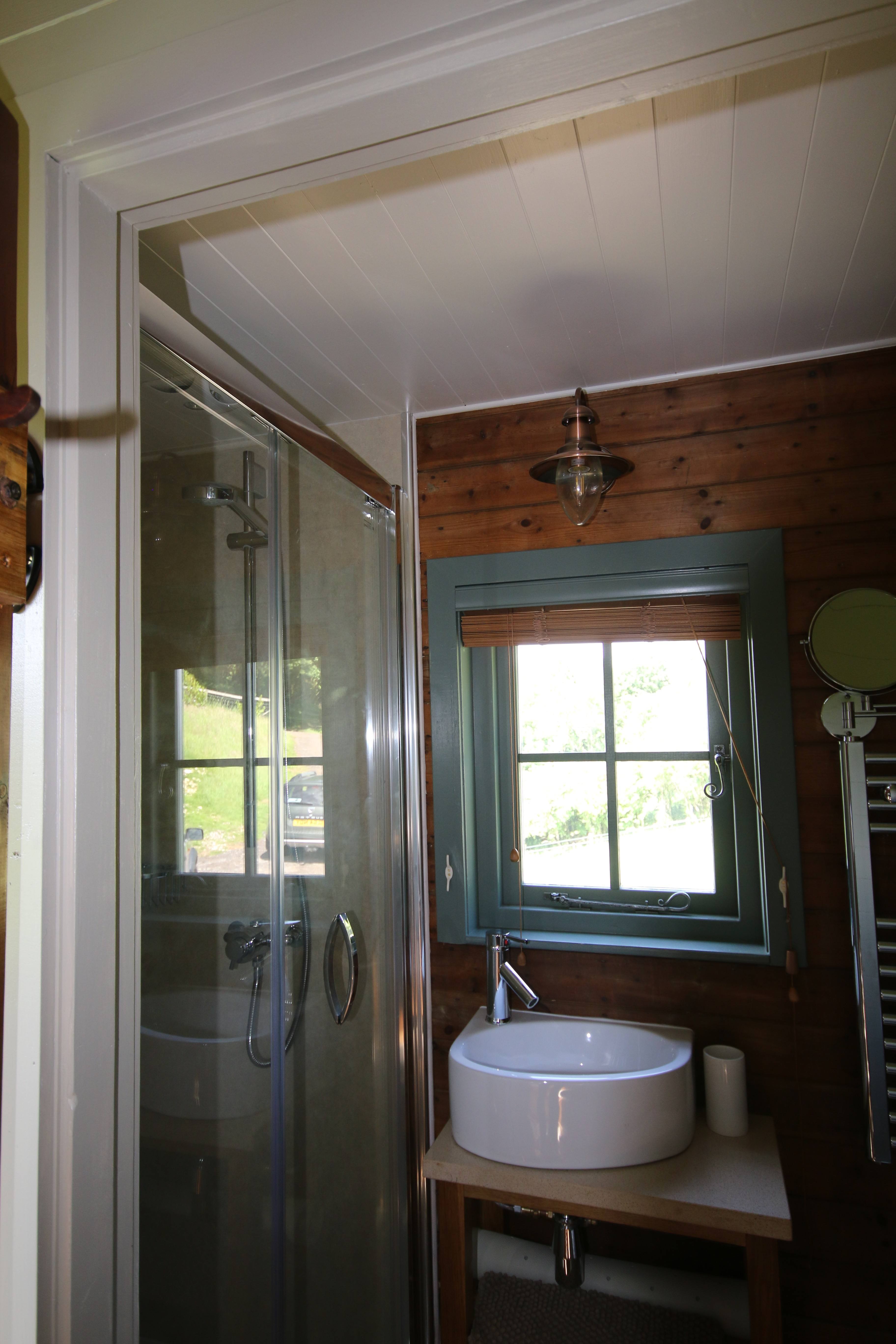 The Shepherds hut ensuite shower and basin
